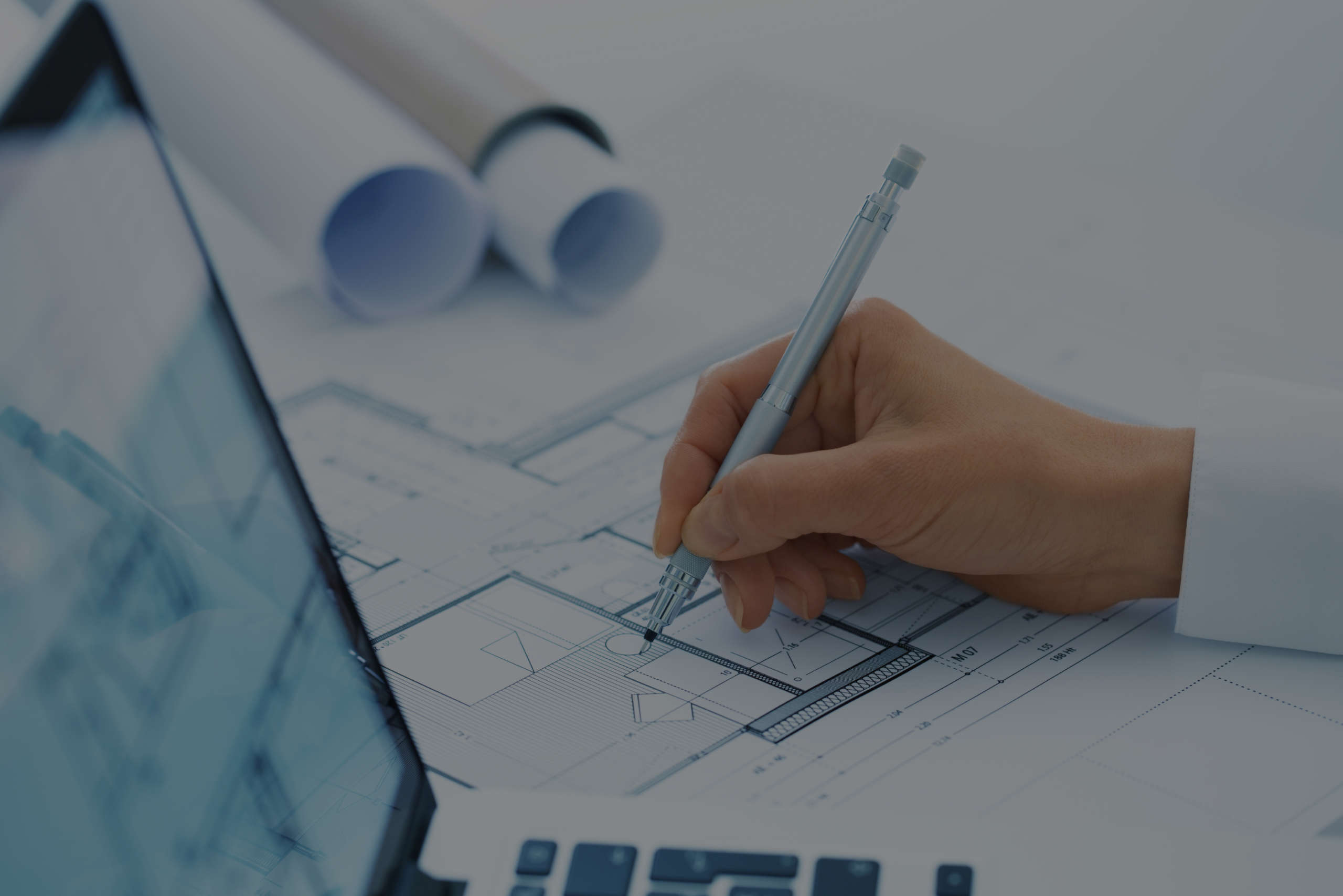 Woman Architect drawing on print construction project