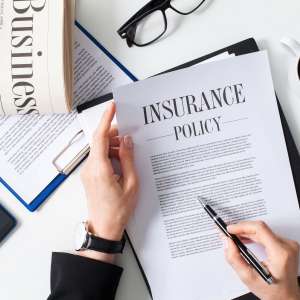 Business woman examining insurance policy